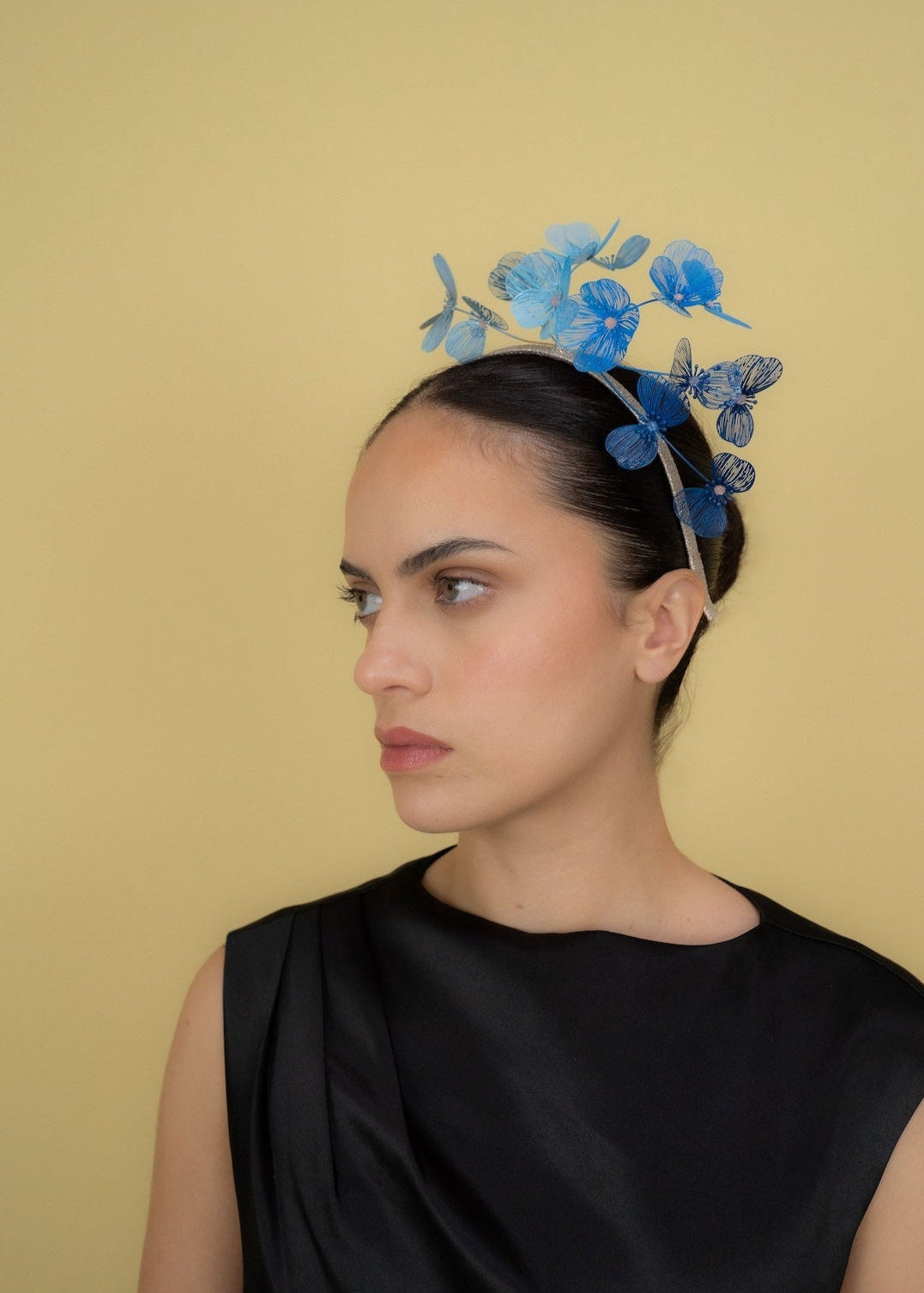 girl wearing blue fascinator millinery headpiece to Melbourne cup