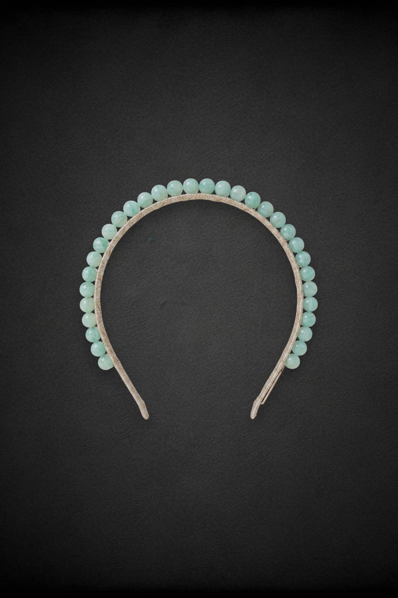 A mint green beaded headband for racing events like melbourne cup