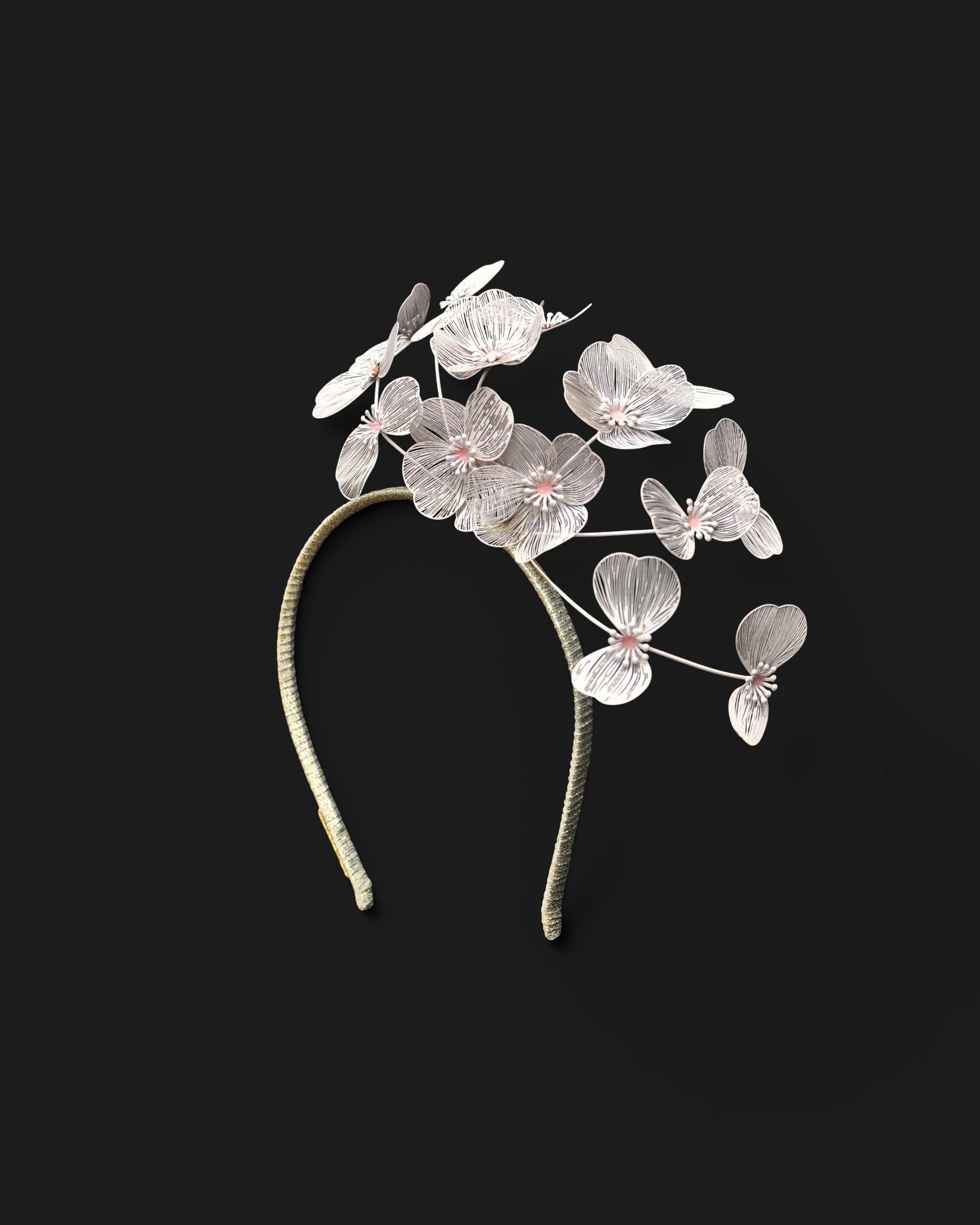 A pastel pink floral millinery headband featuring delicate lightweight flowers perfect for melbourne cup