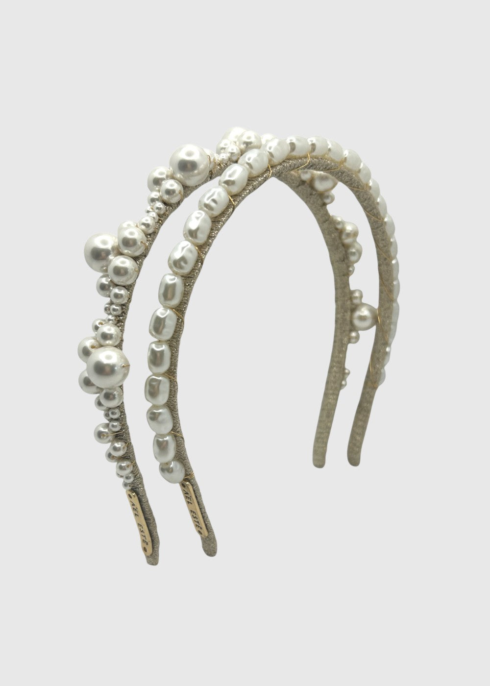 Pearl embellished headband on a light gray background